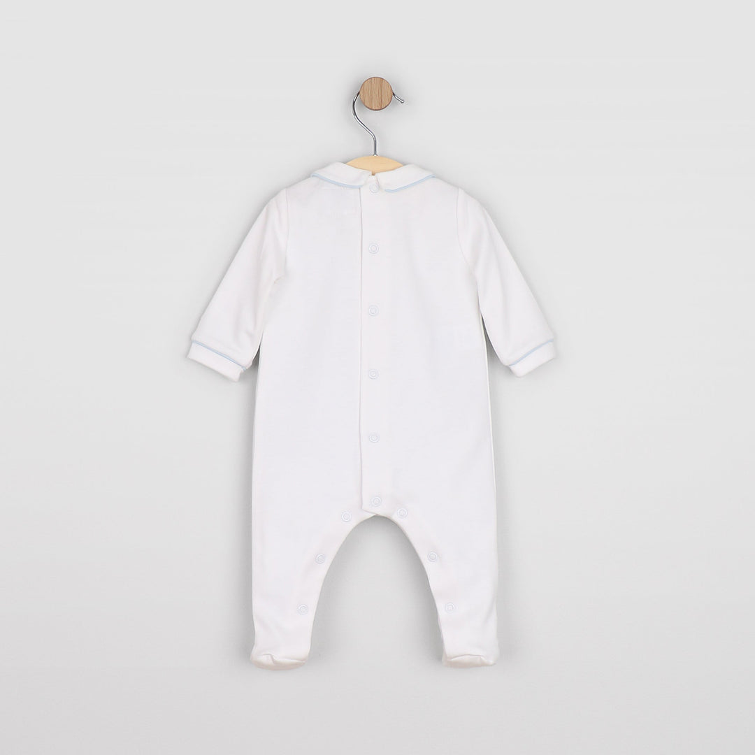 Baby wearing Lenny blue and white babygrow