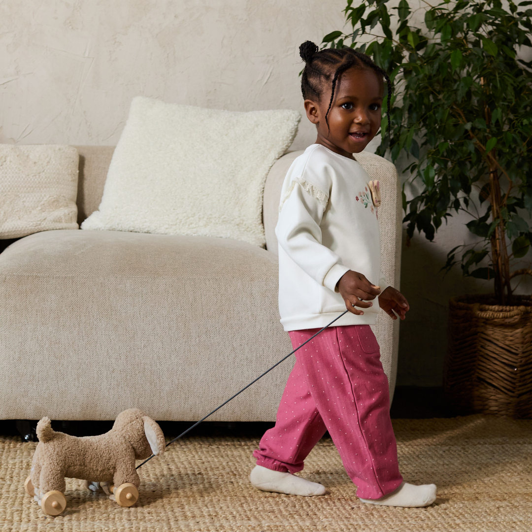 Mini Cuddles baby girl knit trousers worn by child