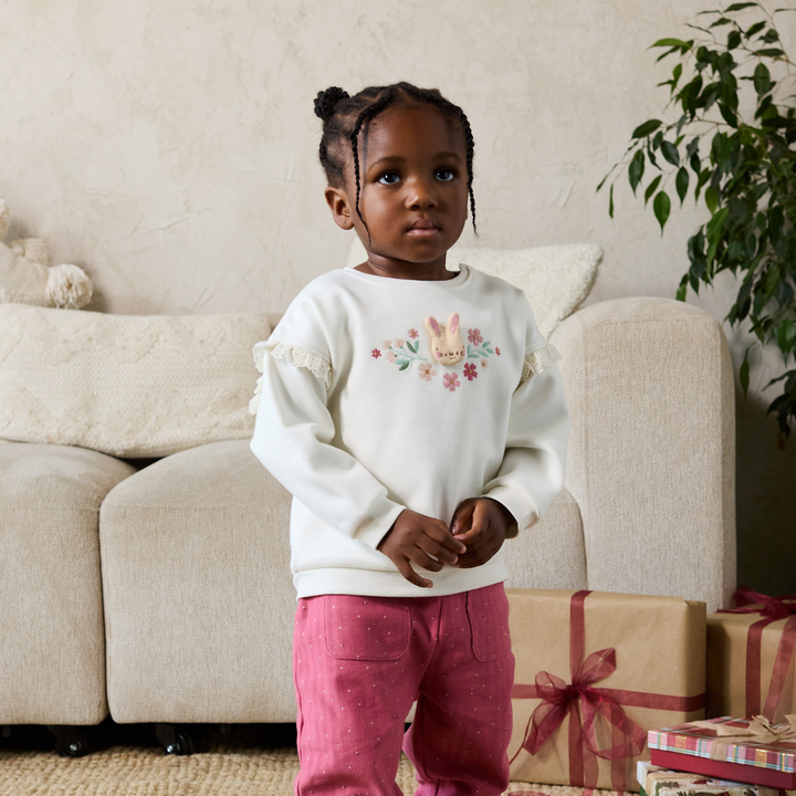 Mini Cuddles baby girl knit trousers styled with a sweatshirt
