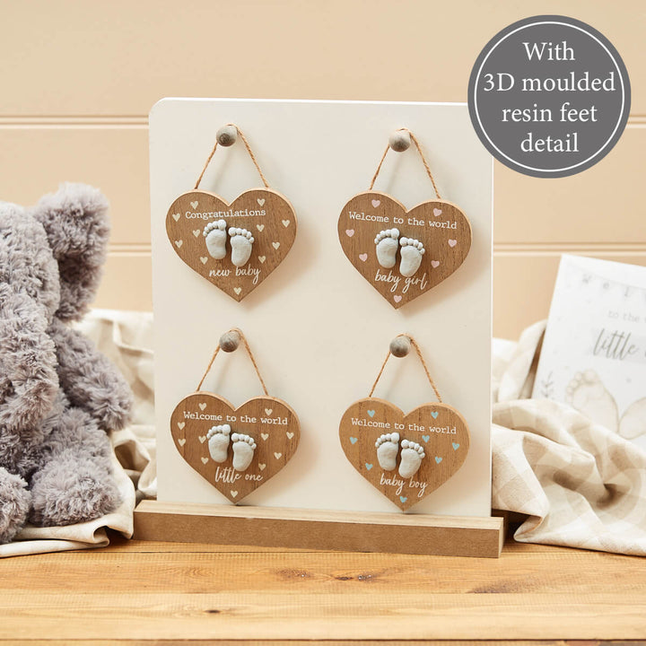 Richard Lang baby feet wooden heart hangers in four designs: New Baby, Little One, Baby Boy and Baby Girl
