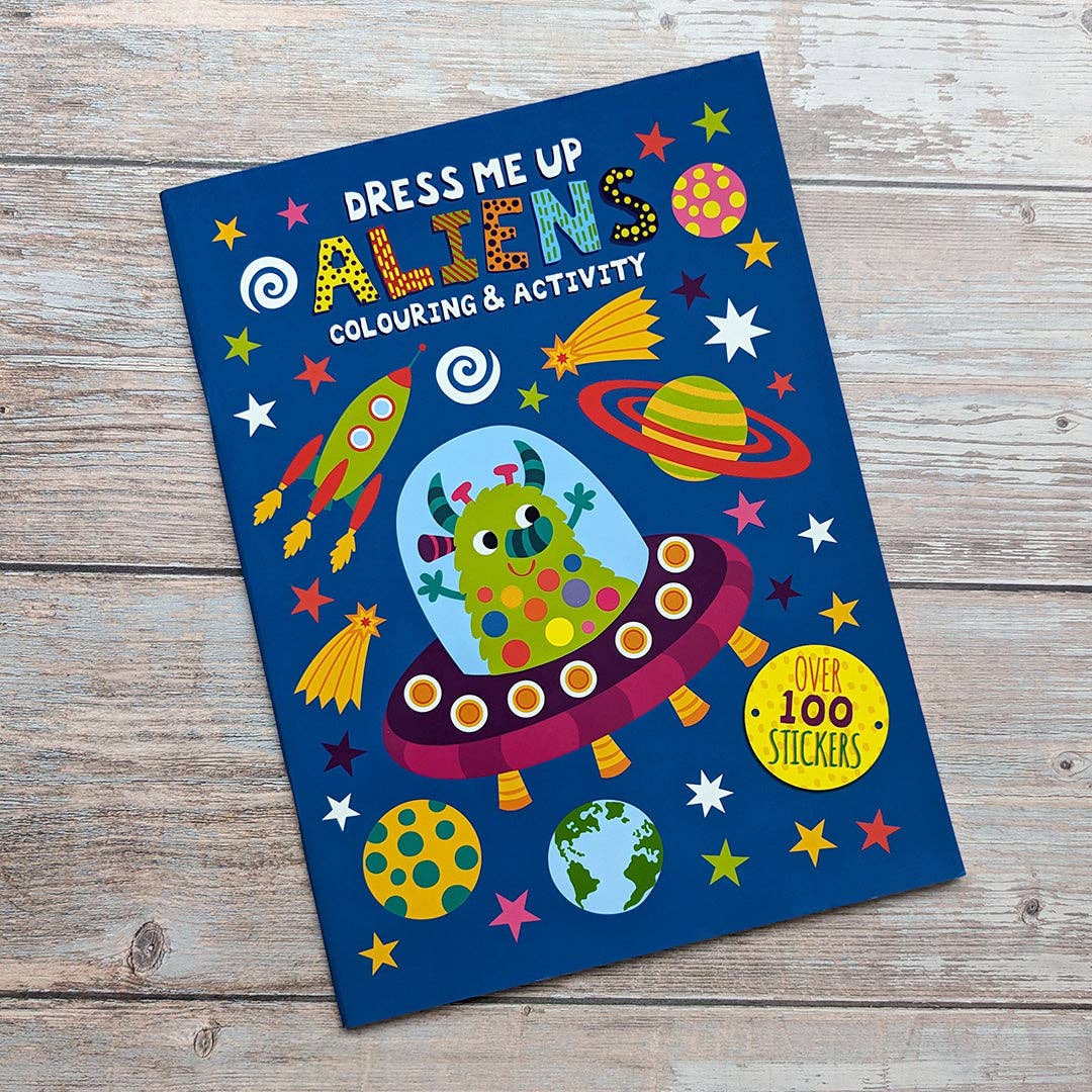 Child using Dress Me Up Aliens colouring and activity book