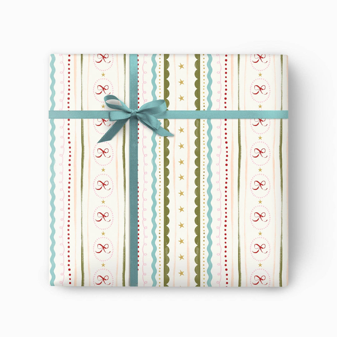 Gingham and bows Christmas wrapping paper in soft festive tones