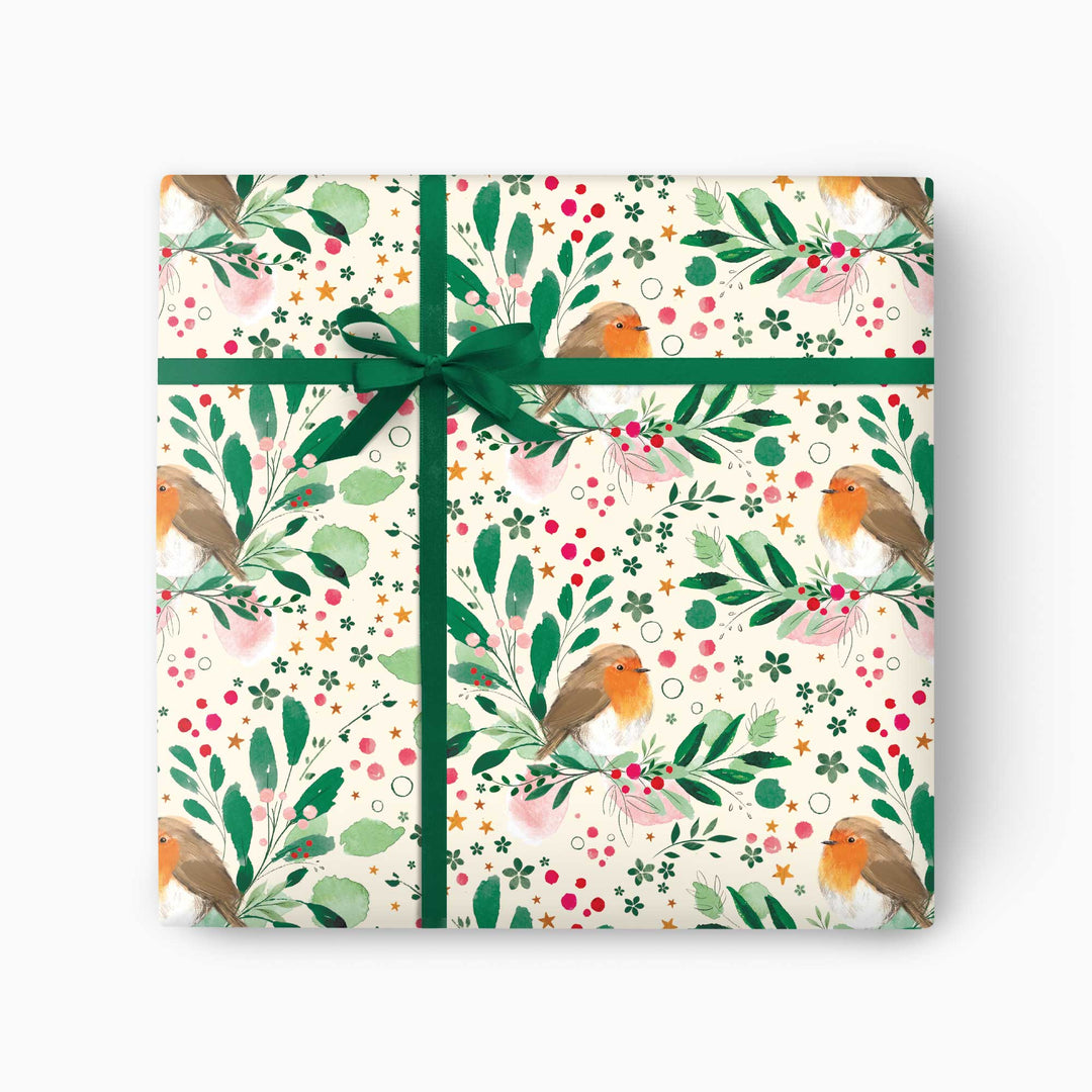 Robin and holly Christmas wrapping paper with winter greenery