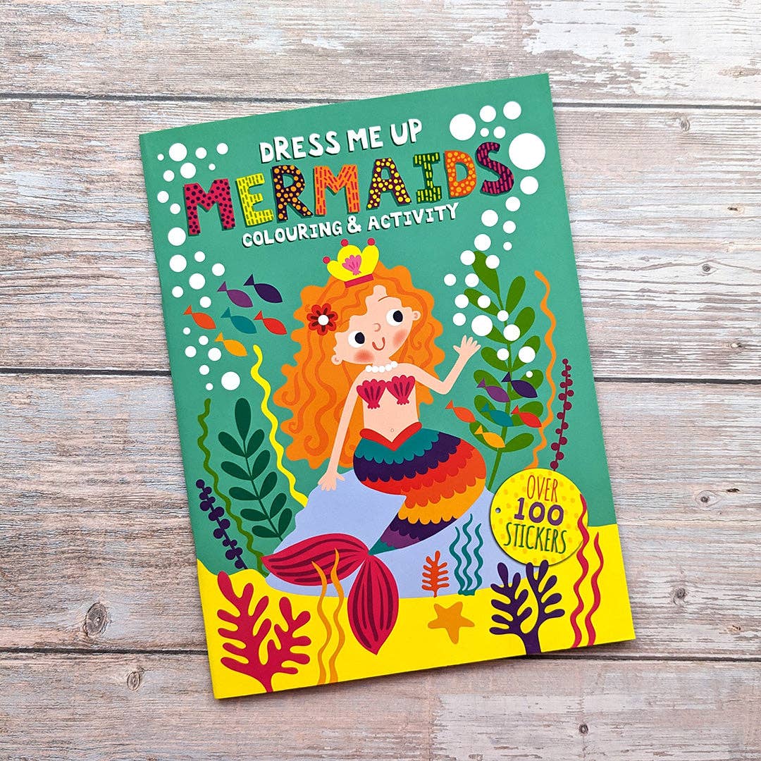 Child using Dress Me Up Mermaids colouring and activity book