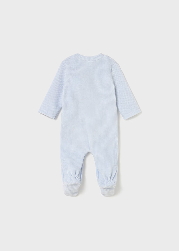 Newborn wearing Mayoral rompers with feet