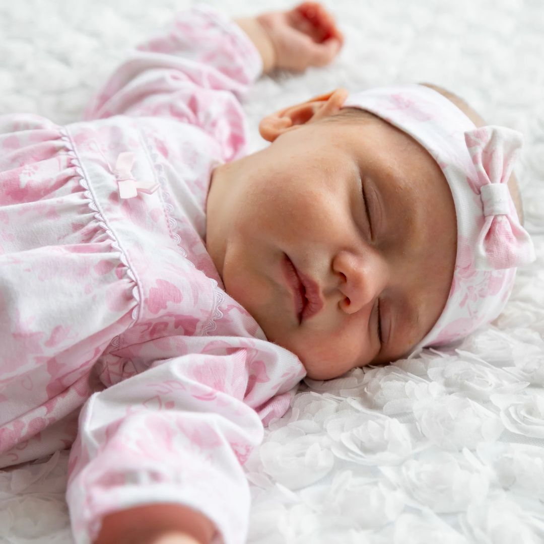 Emile et Rose Mary pink floral print babygrow with ric-rac bow trim and matching headband