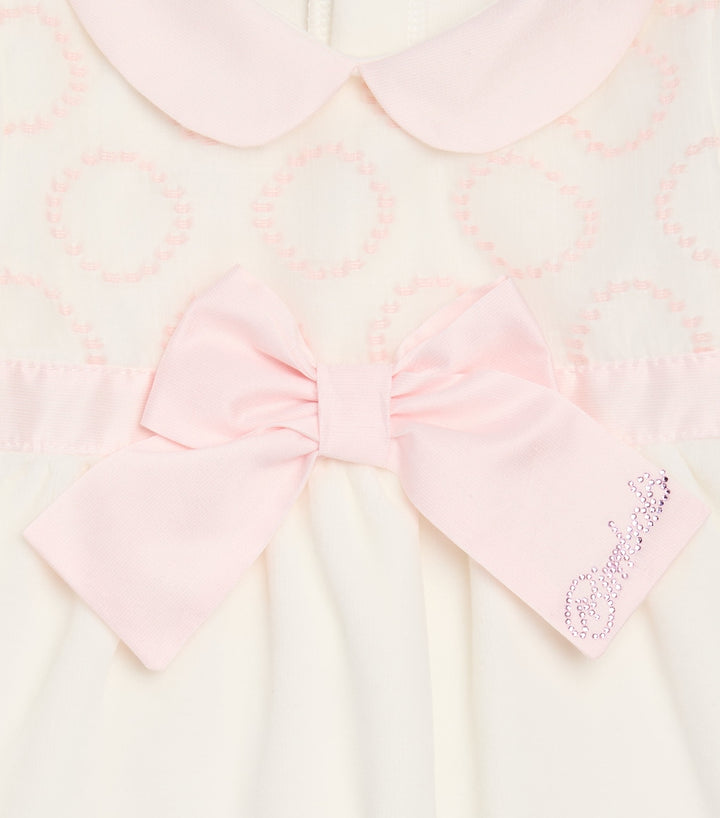 Bimbalò Rosa pink baby romper with jacquard bodice, long sleeves and press-stud fastening